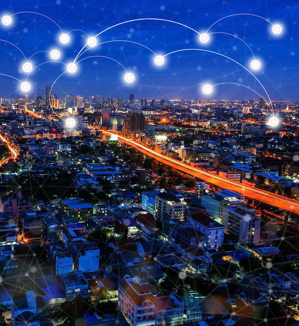 Modern wireless connection technology in smart city. Closeup dots globe with connection lines and dots over the business center city at night. Modern wireless connection technology in smart city. Closeup dots globe with connection lines and dots over the business center city at night.