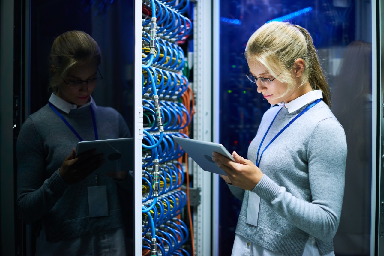 Young Woman Working with Supercomputer Young Woman Working with Supercomputer